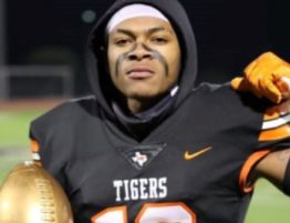 A picture of Tony Evens Jr. in is high school football uniform